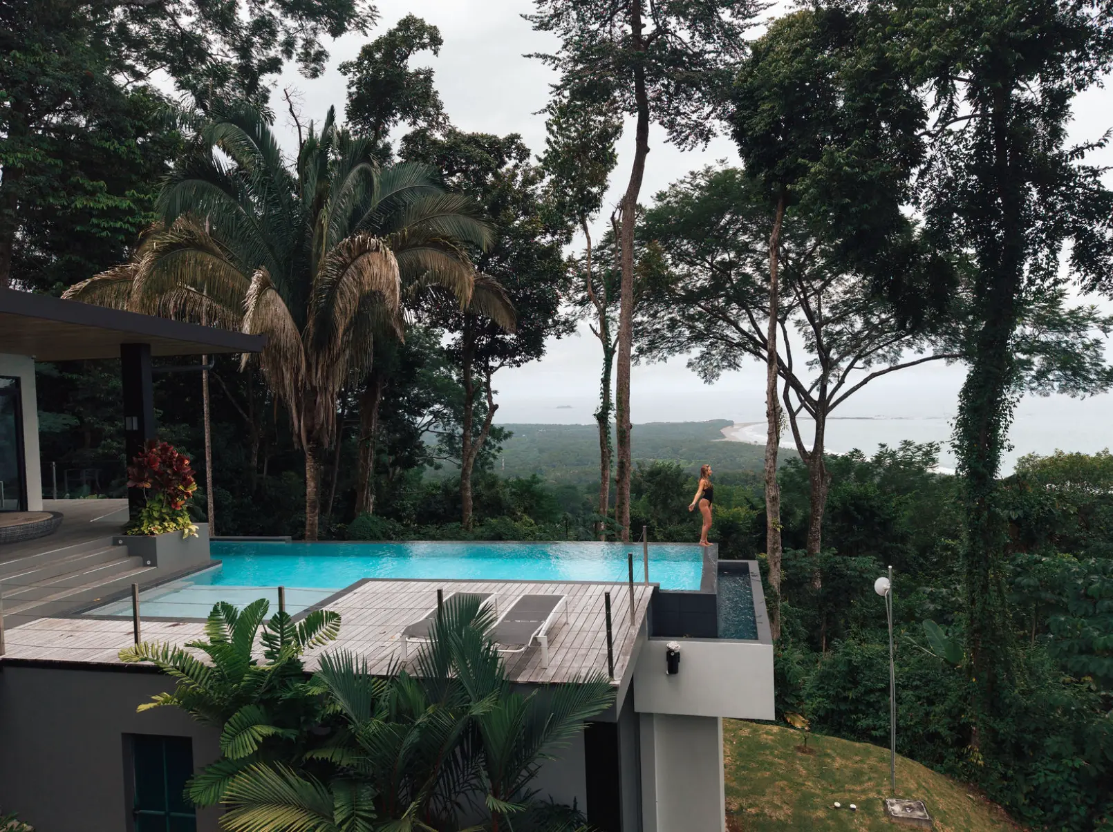 An infinity pool overlooking a green tropical valley